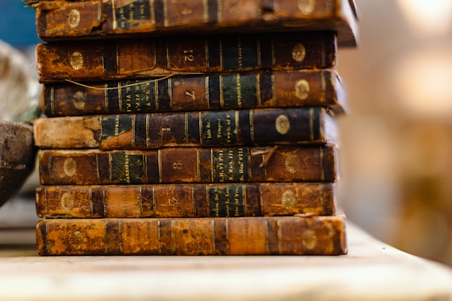 Stack of books representing a publishing house committed to craft and consistency