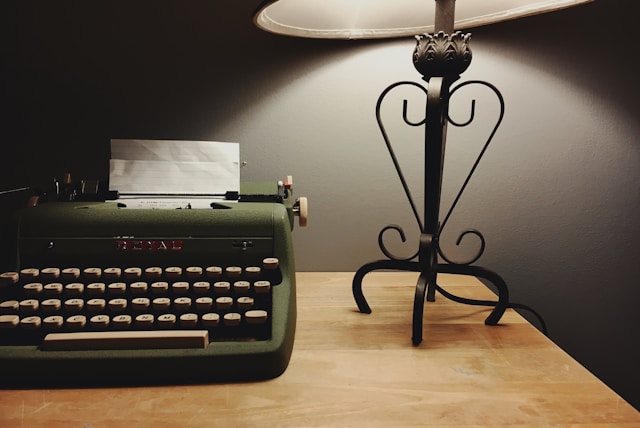 Close-up of a vintage typewriter, symbolizing traditional storytelling craft.